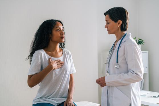 Woman talking to doctor